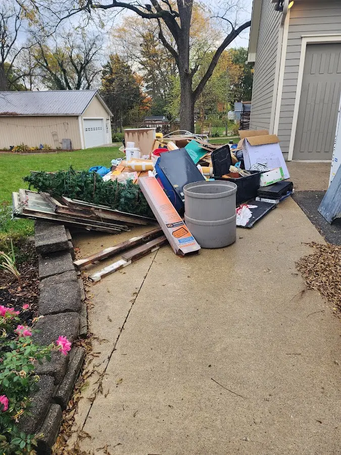 Dumpster being loaded with debris for Demolition Dumpster Rental in Burnet
